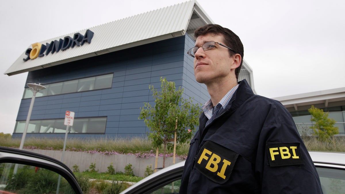 Sept. 8, 2011: FBI agents stand guard outside of Solyndra headquarters in Fremont, Calif. The FBI executed search warrants at the headquarters of California solar firm Solyndra that received a $535 million loan from the federal government.