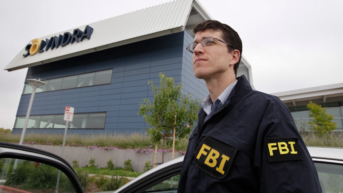 Sept. 8, 2011: FBI agents stand guard outside of Solyndra headquarters in Fremont, Calif. The FBI executed search warrants at the headquarters of California solar firm Solyndra that received a $535 million loan from the federal government.