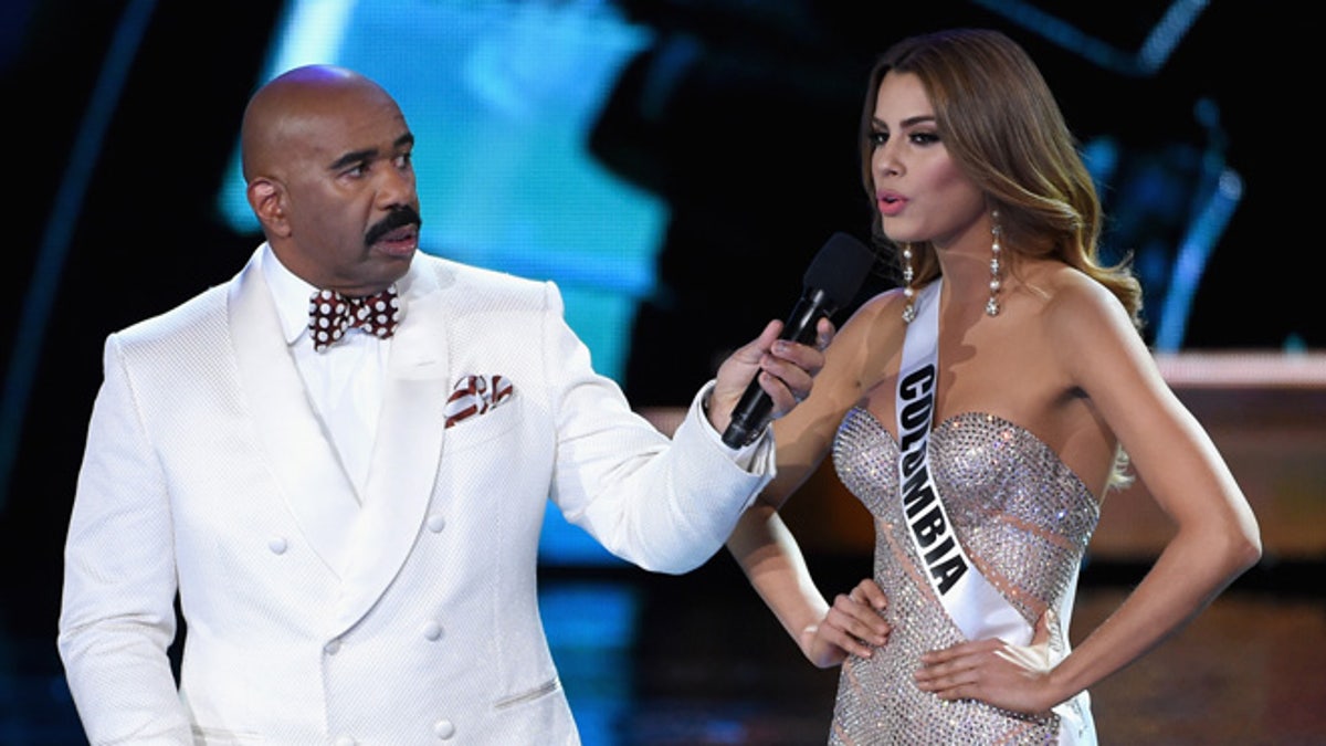 LAS VEGAS, NV - DECEMBER 20: Host Steve Harvey (L) listens as Miss Colombia 2015, Ariadna Gutierrez Arevalo, answers a question during the interview portion of the 2015 Miss Universe Pageant at The Axis at Planet Hollywood Resort & Casino on December 20, 2015 in Las Vegas, Nevada. (Photo by Ethan Miller/Getty Images)