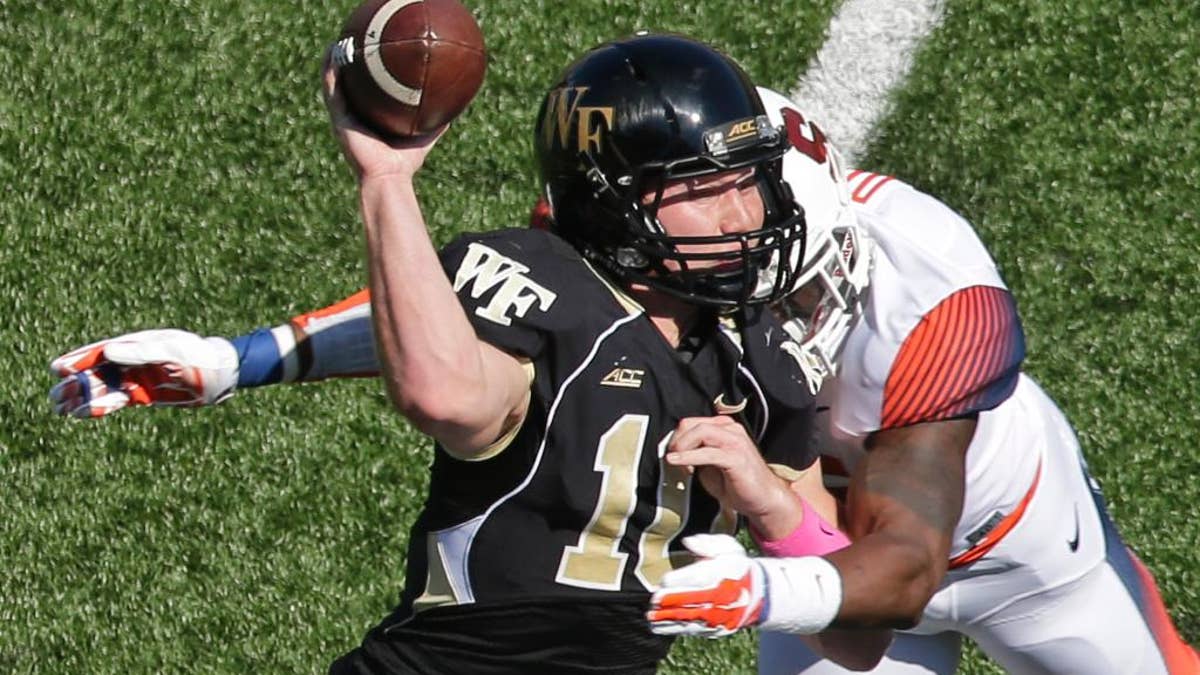 Wake Forest quarterback John Wolford leaves game after taking