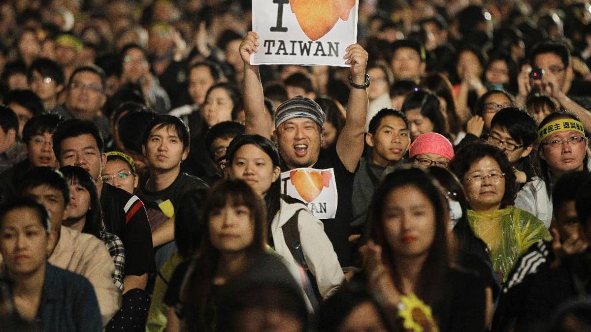 Taiwanese demonstrators celebrate outside the Taiwan presidential building
