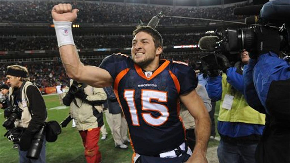 Jan. 8: Denver Broncos quarterback Tim Tebow (15) celebrates after beating the Pittsburgh Steelers 29-23 in overtime of an NFL wild card playoff football game in Denver. 