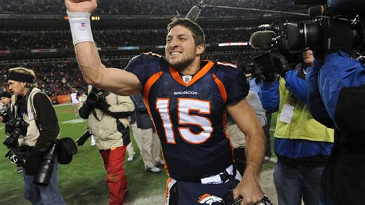 Jan. 8: Denver Broncos quarterback Tim Tebow (15) celebrates after beating the Pittsburgh Steelers 29-23 in overtime of an NFL wild card playoff football game in Denver. 