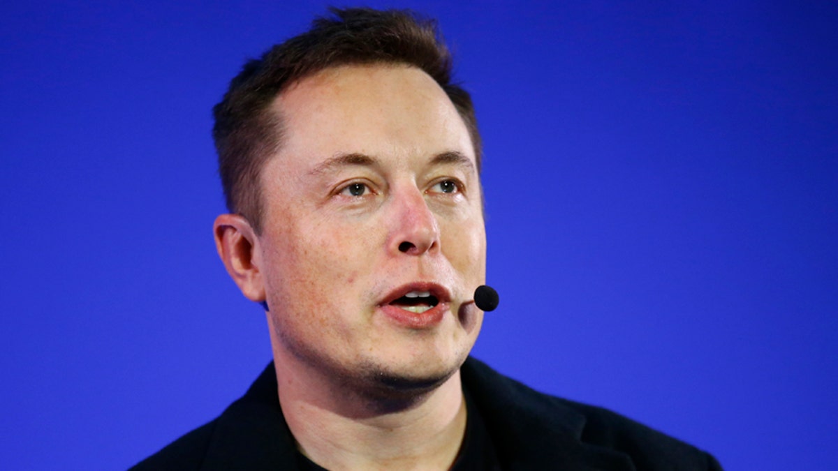 Elon Musk speaking at an event
