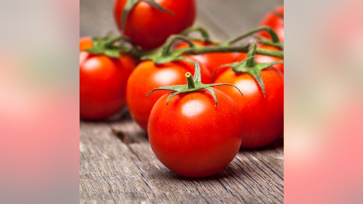Close-up of fresh, ripe cherry tomatoes on wood