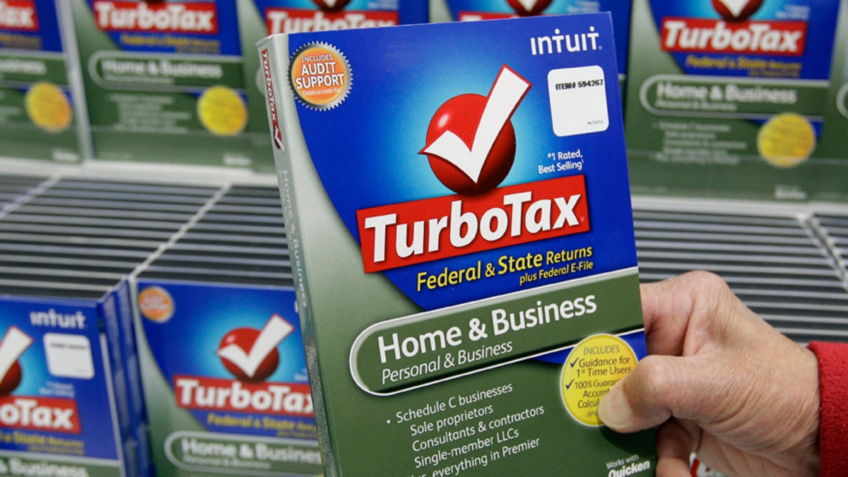 FILE - In this Jan. 24, 2013 file photo, a customer looks at a copy of TurboTax on sale at Costco in Mountain View, Calif.