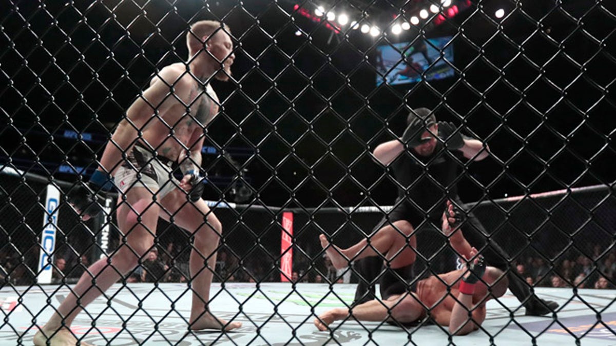 Conor McGregor becomes UFCs first 2-division champ after knocking out Eddie Alvarez Fox News
