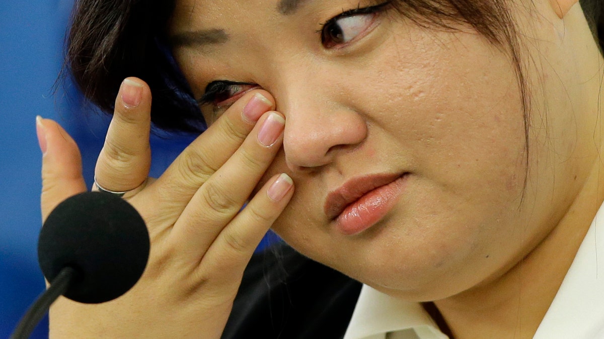 Oct. 30, 2013 - FILE photo of Jin hye Jo wiping a tear as she testifies in Washington D.C. during a hearing of the UN-mandated Commission of Inquiry about human rights in North Korea. Her father was tortured in detention in North Korea and died. Her elder sister went searching for food during the great famine of the 1990s, only to be trafficked to China. Her two younger brothers died of starvation, one of them a baby without milk whose life ebbed away in her arms.