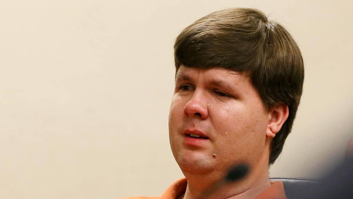 FILE - In a Thursday, July 3, 2014 file photo, Justin Ross Harris, the father of a toddler who died after police say he was left in a hot car for about seven hours, weeps as he sits at his bond hearing in Cobb County Magistrate Court, in Marietta, Ga. On Thursday,, Sept. 4, 2014, a Cobb County grand jury indicted Harris on multiple charges, including malice murder, felony murder and cruelty to children. The malice murder charge indicates that prosecutors believe that Harris intentionally left his son Cooper in the hot car to die. (AP Photo/Marietta Daily Journal, Kelly J. Huff, Pool, File)
