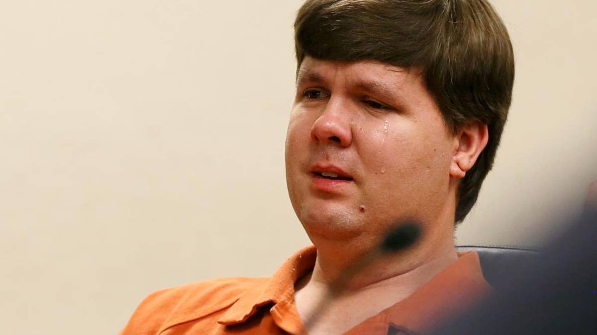 FILE - In a Thursday, July 3, 2014 file photo, Justin Ross Harris, the father of a toddler who died after police say he was left in a hot car for about seven hours, weeps as he sits at his bond hearing in Cobb County Magistrate Court, in Marietta, Ga. On Thursday,, Sept. 4, 2014, a Cobb County grand jury indicted Harris on multiple charges, including malice murder, felony murder and cruelty to children. The malice murder charge indicates that prosecutors believe that Harris intentionally left his son Cooper in the hot car to die. (AP Photo/Marietta Daily Journal, Kelly J. Huff, Pool, File)