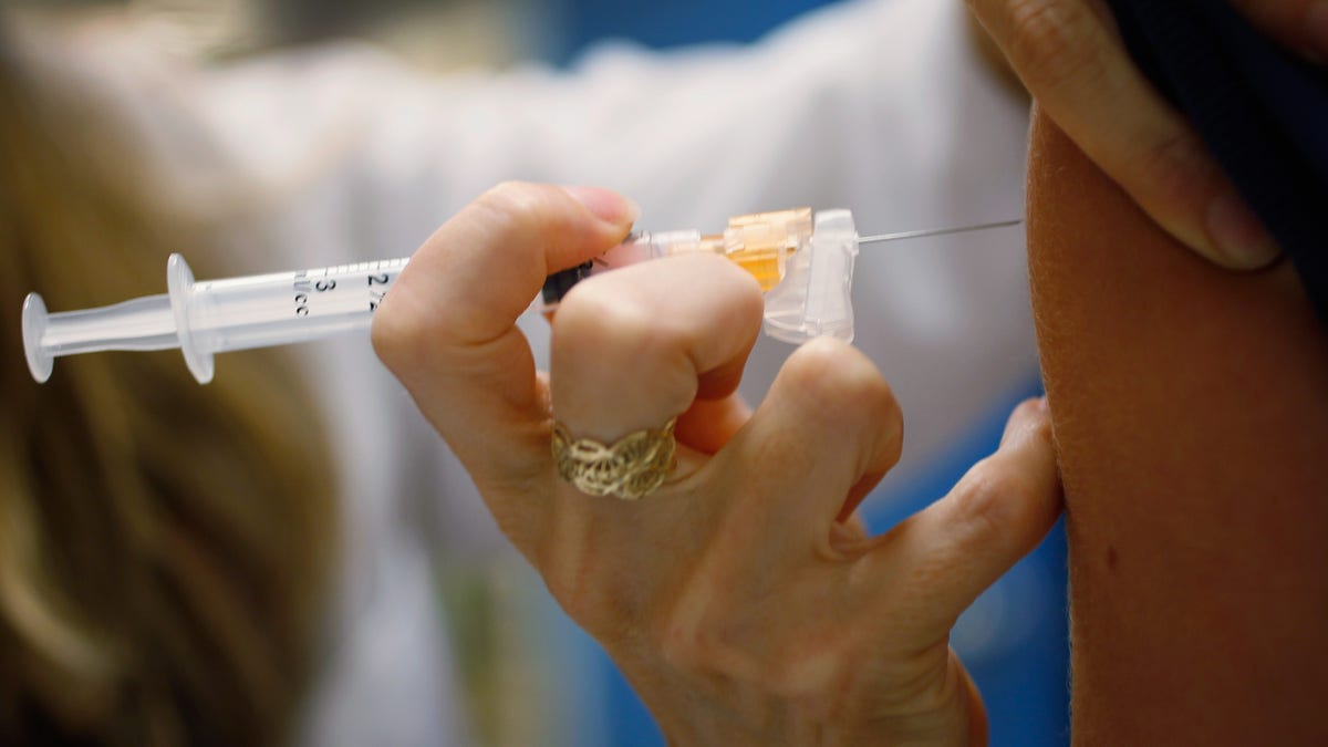 MIAMI, FL - SEPTEMBER 21: University of Miami pediatrician, Judith L. Schaechter, M.D., gives an HPV vaccination to a 13-year-old girl in her office at the Miller School of Medicine on September 21, 2011 in Miami, Florida. The vaccine for human papillomavirus, or HPV, is given to prevent a sexually transmitted infection that can cause cancer. Recently the issue of the vaccination came up during the Republican race for president when Rep. Michele Bachmann (R-MN) called the vaccine to prevent cervical cancer