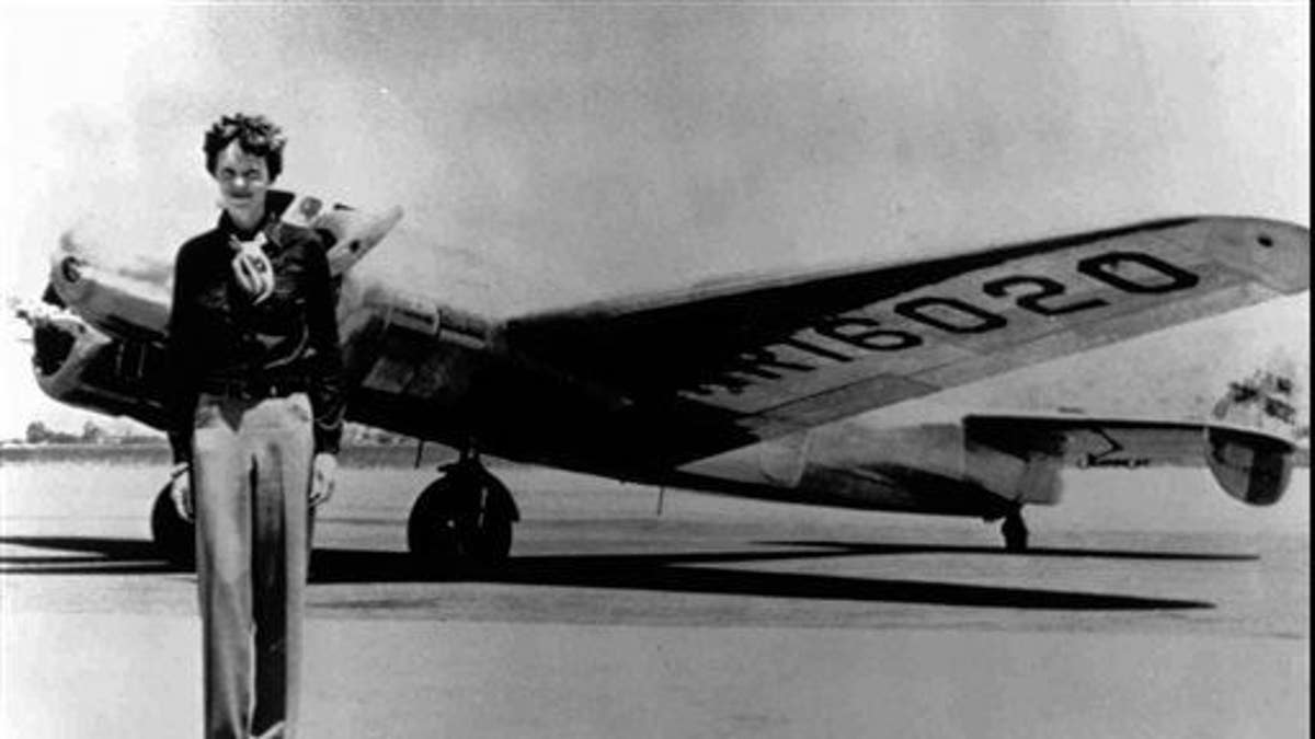 Amelia Earhart stands next to a Lockheed Electra 10E, before her last flight in 1937 from Oakland, Calif.