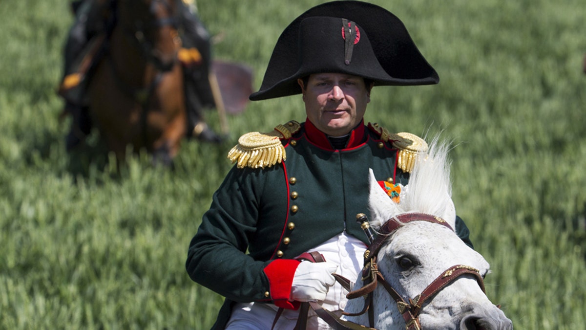 Frenchman Frank Samson takes part in the re-enactment of the battle of Ligny, as French Emperor Napoleon, during the bicentennial celebrations for the Battle of Waterloo, in Ligny, Belgium, June 14, 2015. 