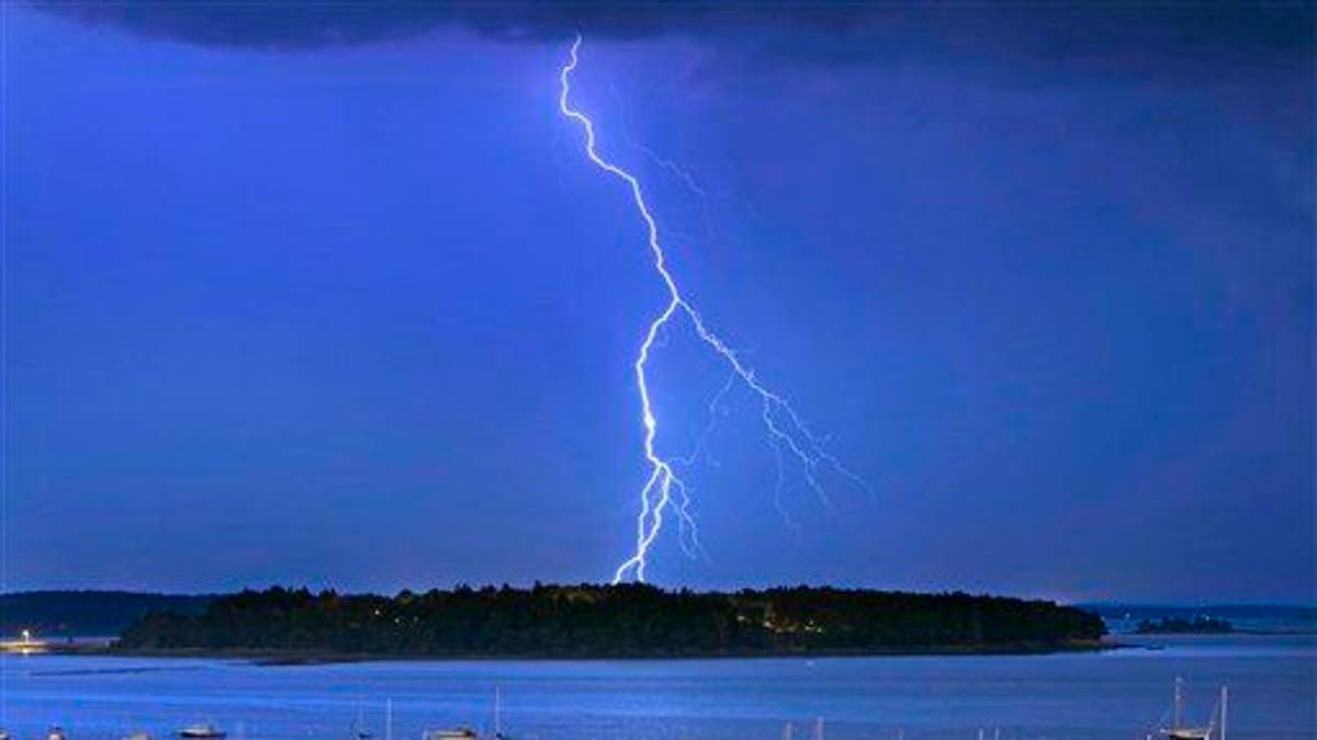 In this Sept. 11, 2013, file photo, lightning strikes north of Mackworth Island in Maine.