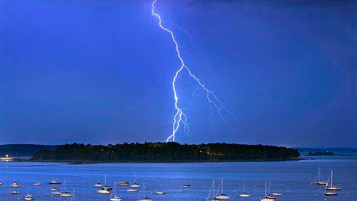 In this Sept. 11, 2013, file photo, lightning strikes north of Mackworth Island in Maine.