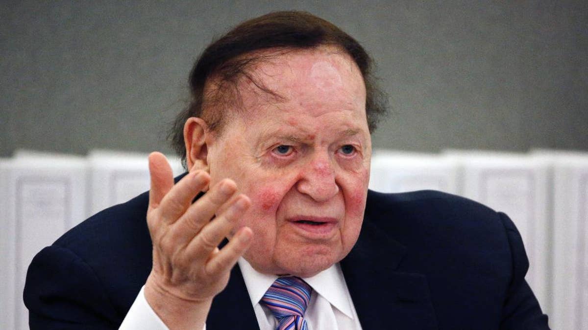 FILE - In this May 4, 2015, file photo, Las Vegas Sands Corp. Chairman and CEO Sheldon Adelson speaks in Las Vegas. Billionaire Adelson's casino company is settling a long-running lawsuit with the former head of its Chinese arm. Sands China said Wednesday, June 1, 2016, that both sides “reached a comprehensive and confidential settlement” with Steven Jacobs, the company’s former CEO. Jacobs’ wrongful termination case against Adelson and Sands China’s parent, Las Vegas Sands Corp., had threatened to air boardroom decisions about how the company developed its lucrative interests in the Chinese gambling enclave of Macau. (AP Photo/John Locher, File)