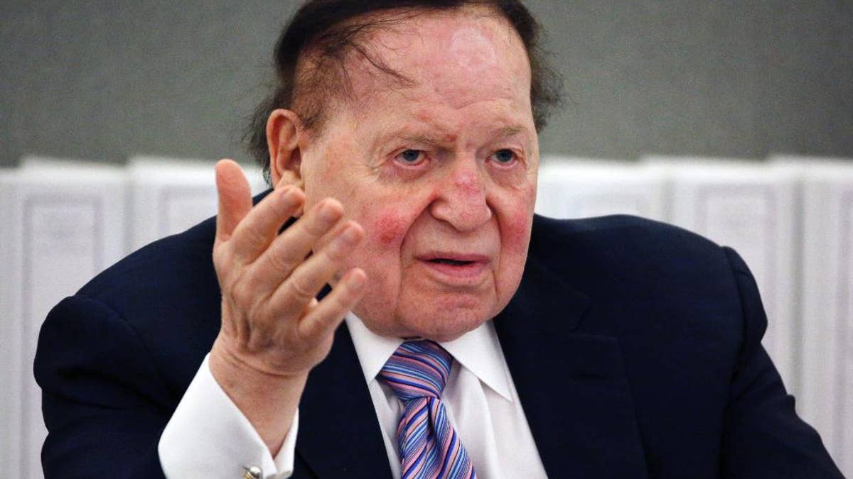 FILE - In this May 4, 2015, file photo, Las Vegas Sands Corp. Chairman and CEO Sheldon Adelson speaks in Las Vegas. Billionaire Adelson's casino company is settling a long-running lawsuit with the former head of its Chinese arm. Sands China said Wednesday, June 1, 2016, that both sides “reached a comprehensive and confidential settlement” with Steven Jacobs, the company’s former CEO. Jacobs’ wrongful termination case against Adelson and Sands China’s parent, Las Vegas Sands Corp., had threatened to air boardroom decisions about how the company developed its lucrative interests in the Chinese gambling enclave of Macau. (AP Photo/John Locher, File)