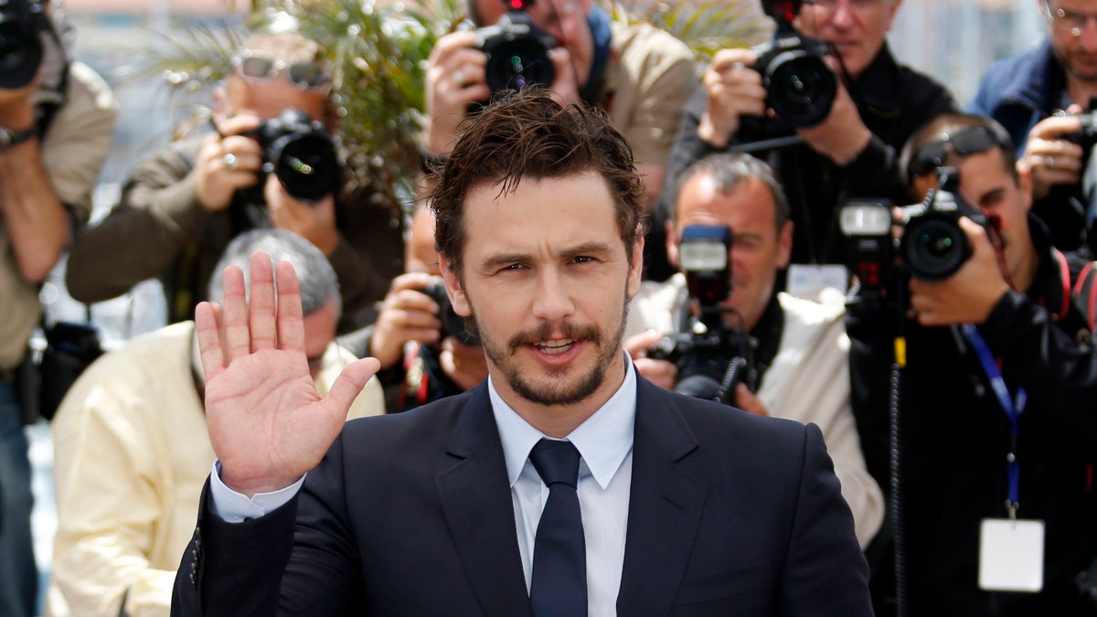 Director and actor James Franco poses during a photocall for the film "As I Lay Dying" at the 66th Cannes Film Festival in Cannes May 20, 2013. REUTERS/Regis Duvignau (FRANCE - Tags: ENTERTAINMENT) - RTXZU1E