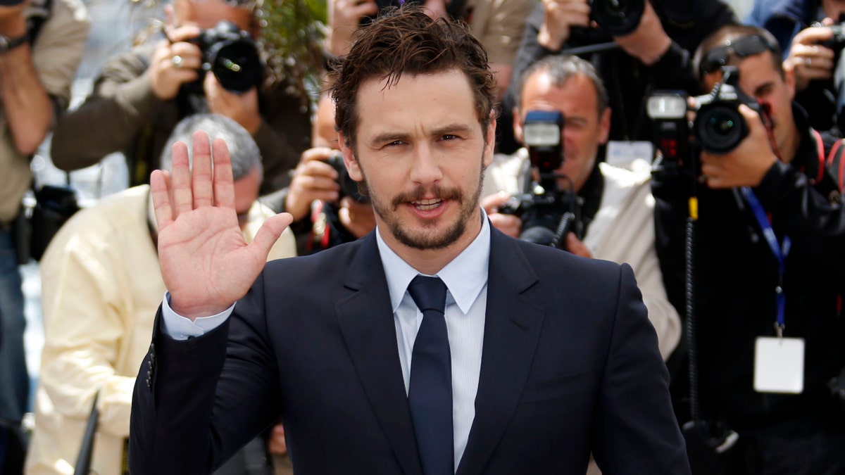 Director and actor James Franco poses during a photocall for the film "As I Lay Dying" at the 66th Cannes Film Festival in Cannes May 20, 2013. REUTERS/Regis Duvignau (FRANCE - Tags: ENTERTAINMENT) - RTXZU1E