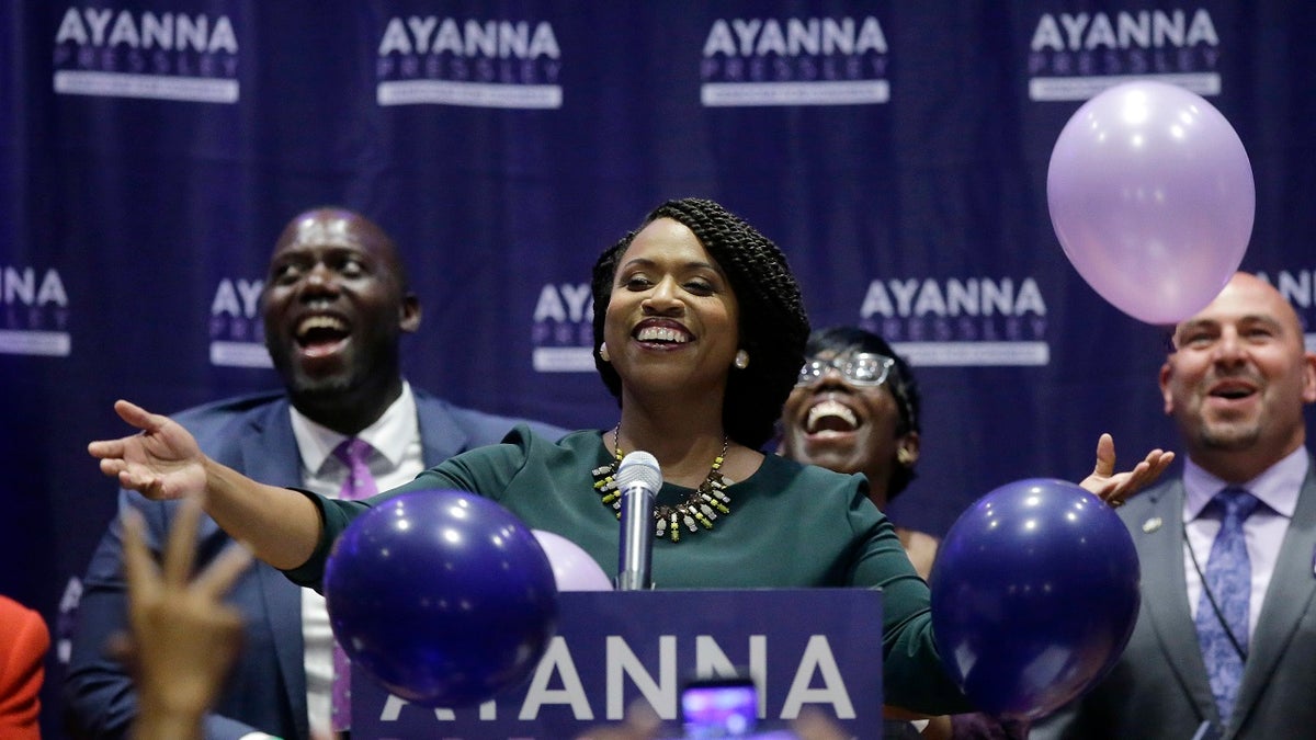 Boston City Councilor Ayanna Pressley, center, celebrates victory over U.S. Rep. Michael Capuano, D-Mass., in the 7th Congressional House Democratic primary, Tuesday, Sept. 4, 2018, in Boston. (AP Photo/Steven Senne)