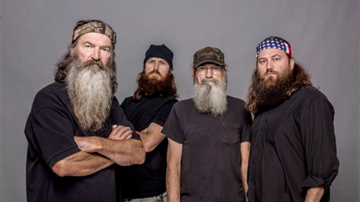 This 2012 photo released by A&E shows, from left, Phil Robertson, Jase Robertson, Si Robertson and Willie Robertson from the A&E series, 