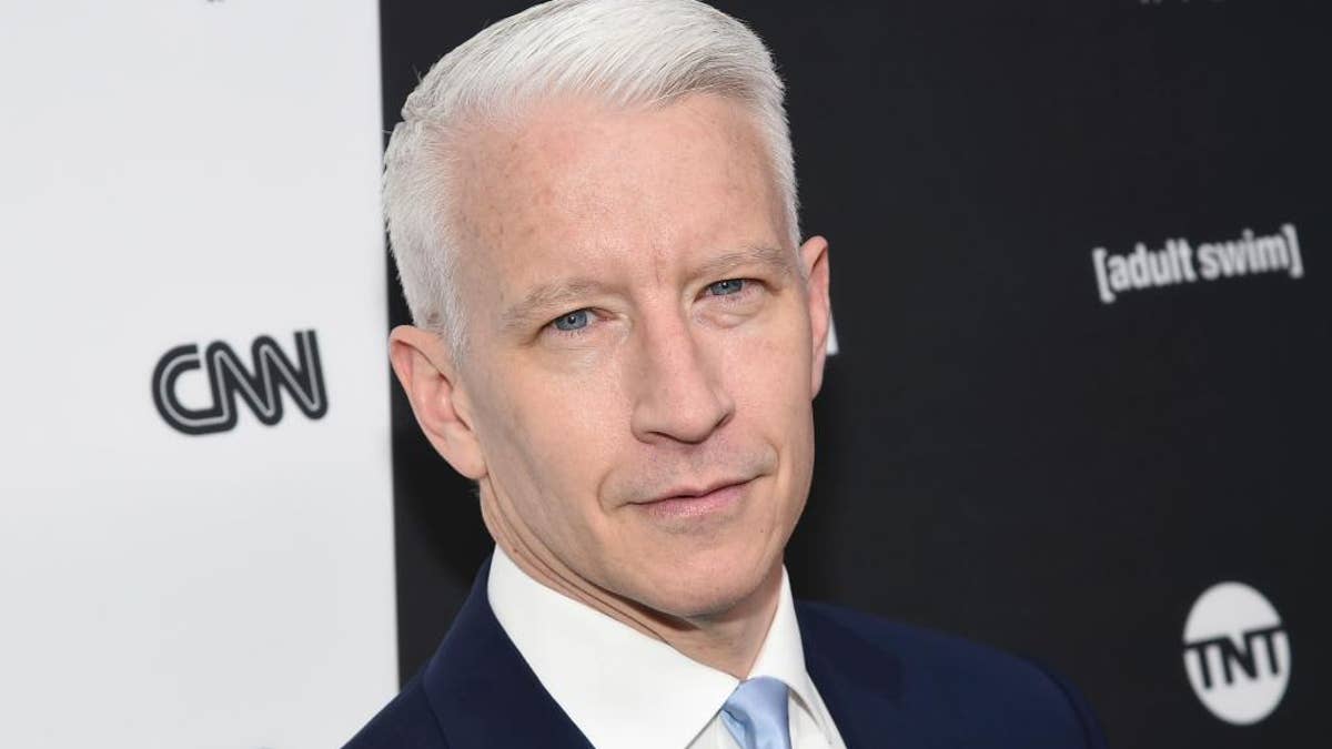 FILE - In this May 18, 2016 file photo, CNN news anchor Anderson Cooper attends the Turner Network 2016 Upfronts in New York. Cooper signed a long-term deal to stay with CNN, a person with knowledge of the agreement said Tuesday, Oct. 4. His decision may put an end to the possibility he'll join Kelly Ripa as co-host of ABC's 