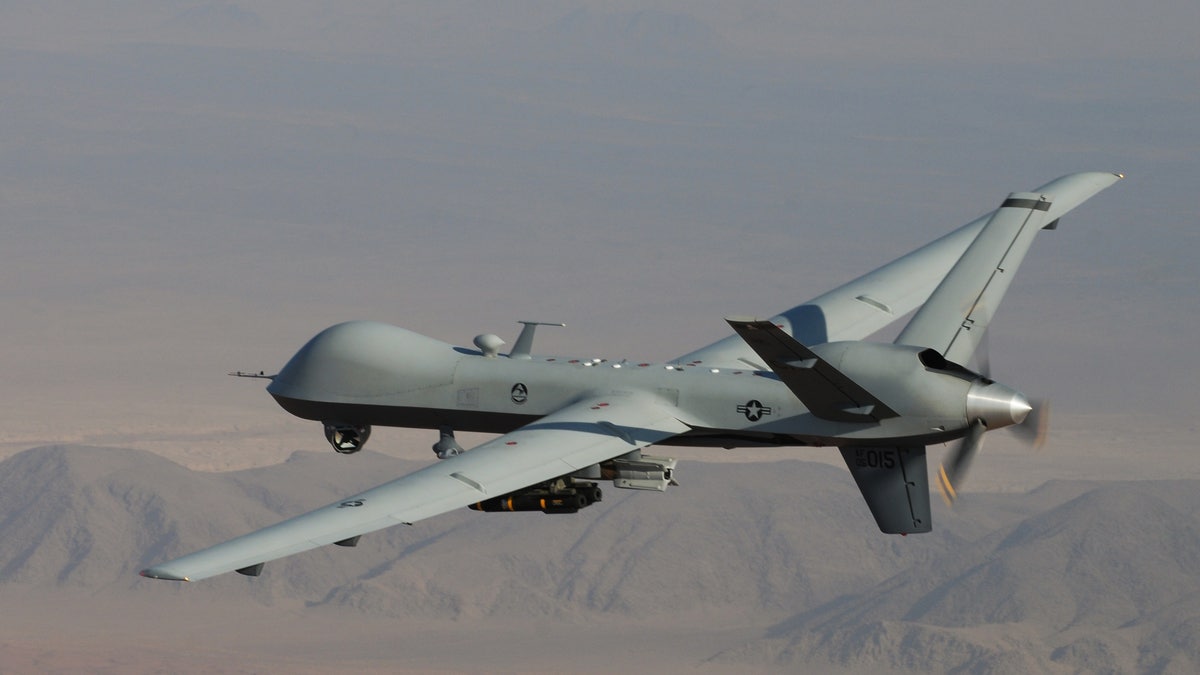 In this undated handout file photo provided by the U.S. Air Force, an MQ-9 Reaper, armed with GBU-12 Paveway II laser guided munitions and AGM-114 Hellfire missiles, is piloted by Col. Lex Turner during a combat mission over southern Afghanistan. 