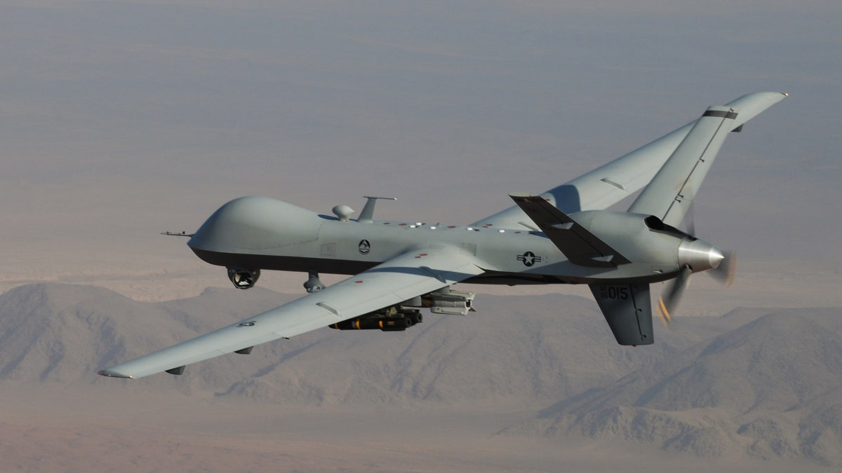 In this undated handout file photo provided by the U.S. Air Force, an MQ-9 Reaper, armed with GBU-12 Paveway II laser guided munitions and AGM-114 Hellfire missiles, is piloted by Col. Lex Turner during a combat mission over southern Afghanistan. 