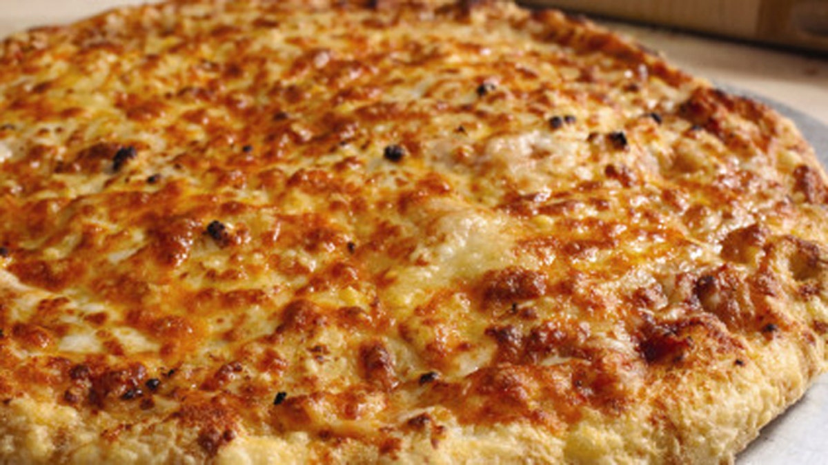 This photo provided by Domino's Pizza Inc., shows the Wisconsin 6 Cheese pizza. Domino's Pizza Inc. is releasing a new pizza called the Wisconsin 6 Cheese on Wednesday, Oct. 13, 2010, continuing its effort to revamp its pizza lines. (AP Photo/Domino's Pizza Inc.) NO SALES