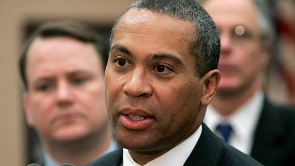 Massachusetts Gov. Deval Patrick addresses an audience at Attleboro, Mass., City Hall, as Lt. Gov. Tim Murray, left, looks on, Wednesday, May 23, 2007. The governor ousted Department of Social Services Commissioner Lewis 