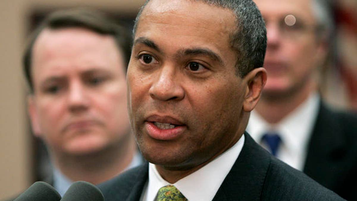 Massachusetts Gov. Deval Patrick addresses an audience at Attleboro, Mass., City Hall, as Lt. Gov. Tim Murray, left, looks on, Wednesday, May 23, 2007. The governor ousted Department of Social Services Commissioner Lewis 