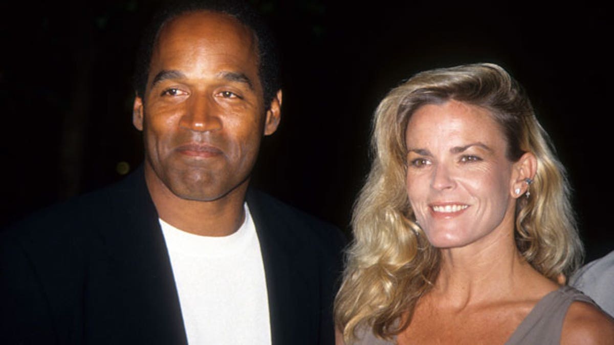 LOS ANGELES - MARCH 16: O.J. Simpson and Nicole Brown Simpson pose at the premiere of the &quot;Naked Gun 33 1/3: The Final Isult&quot; in which O.J. starred on March 16, 1994 in Los Angeles, California. (Photo by Vinnie Zuffante/Archive Photos/Getty Images)