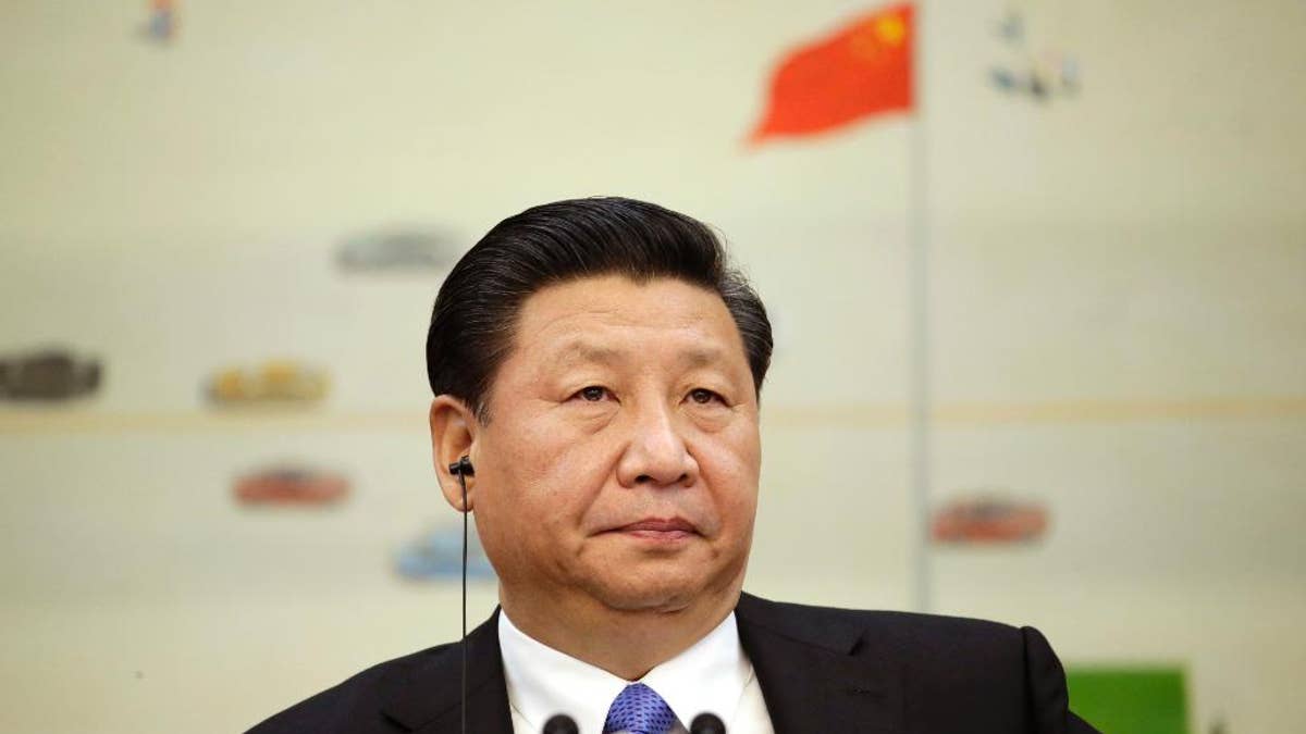 Chinas President Xi Jinping attends a meeting of the second Understanding China Conference, in Beijing, China, Tuesday, Nov. 3, 2015. President Xi Jinping said Tuesday that China needs at least 6.5 percent economic growth in coming years and the Communist Party announced plans to let its tightly controlled yuan trade freely by 2020. (Jason Lee/Pool Photo via AP)