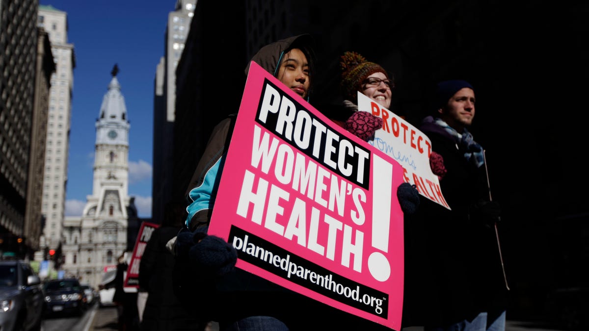 Abortion rights advocates Grace Fried, center, Claire Roden and David Tuke demonstrate in view of Philadelphia City Hall Friday, Jan. 21, 2011 on the eve of the anniversary of the 1973 Roe v. Wade Supreme Court decision that legalized abortion. (AP)