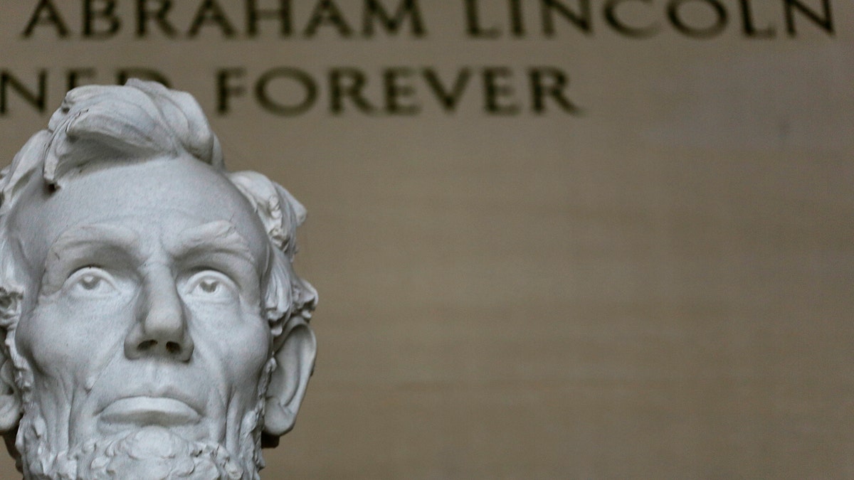 Former U.S. President Abraham Lincoln's statue at the Lincoln Memorial  is seen in Washington March 27, 2015. The 170-ton, 19-foot-high statue, formed from 28 blocks of Georgia marble, was sculpted by Daniel Chester French and carved by the Piccirilli brothers. The 150th anniversary of Lincoln's assassination at Ford's Theatre in Washington is April 15, 2015.  REUTERS/Gary Cameron - RTR4WKKS