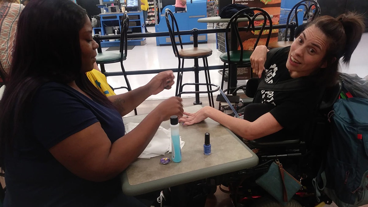 Ebony Harris, refused to let this lovely lady leave with bare nails. So Harris skipped her lunch break to paint Peters's nails herself.