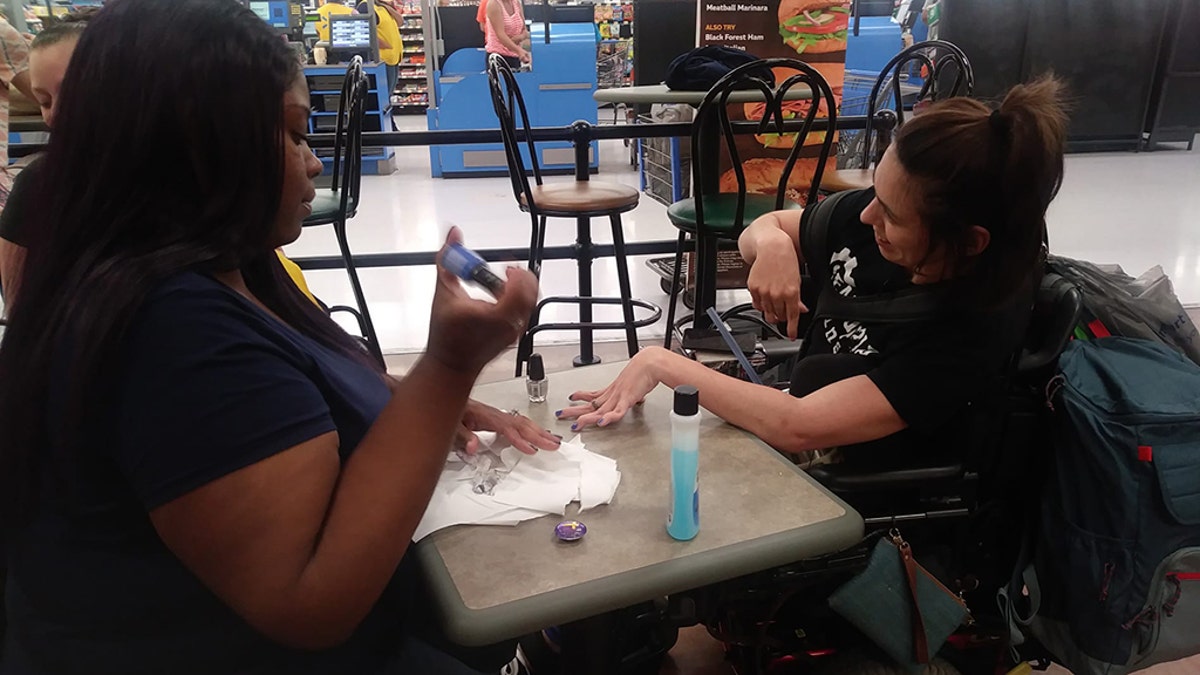 Ebony Harris, refused to let this lovely lady leave with bare nails. So Harris skipped her lunch break to paint Peters's nails herself.
