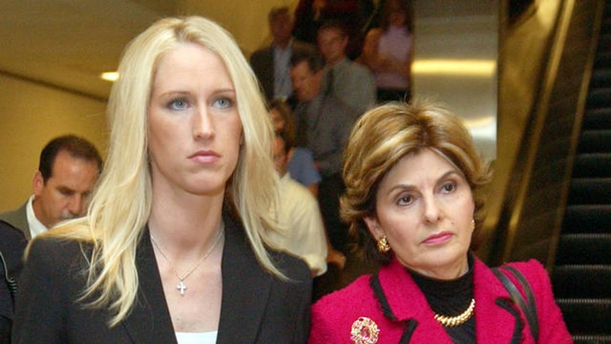 Amber Frey, left, leaves with her attorney Gloria Allred, right, after she testified during the Scott Peterson trial at the Redwood City, Calif., courthouse, Tuesday, Aug. 10, 2004. Peterson is the Modesto, Calif., man who could face the death penalty for the murder of his wife, Laci Peterson, and their unborn son. (AP Photo/Paul Sakuma, pool)