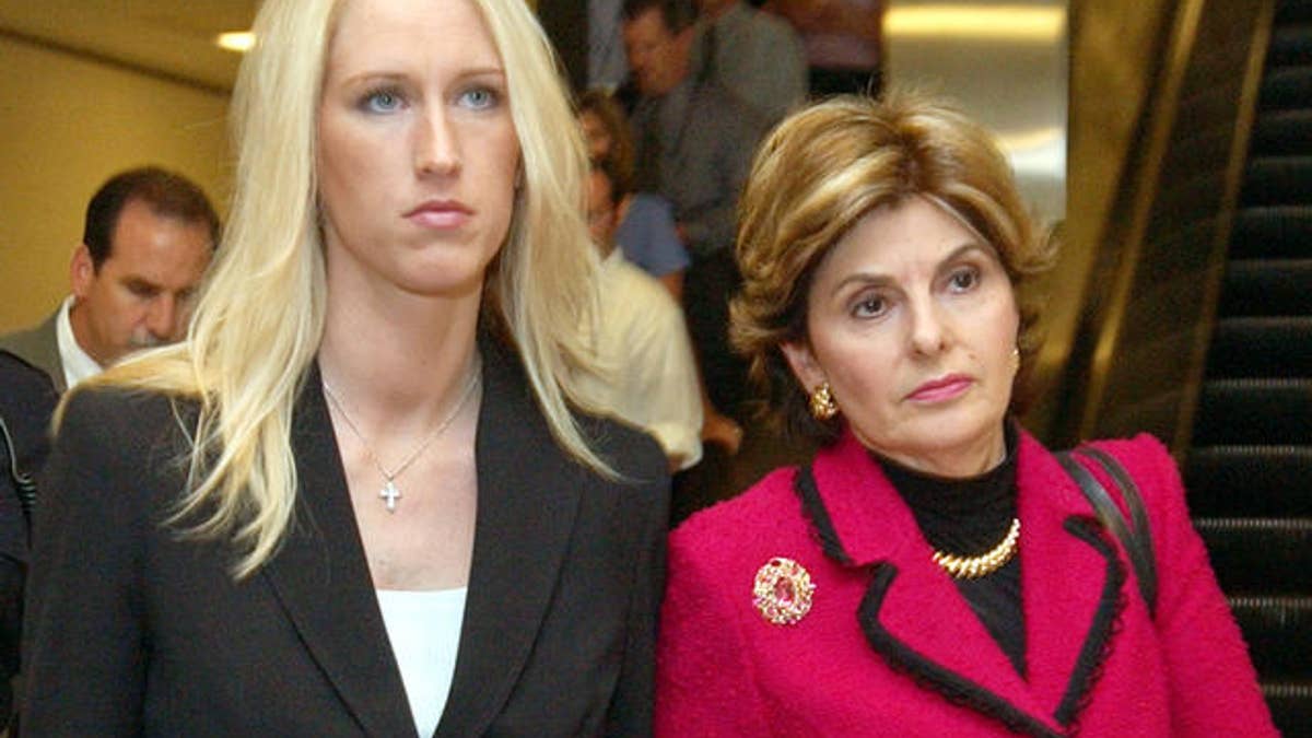 Amber Frey, left, leaves with her attorney Gloria Allred, right, after she testified during the Scott Peterson trial at the Redwood City, Calif., courthouse, Tuesday, Aug. 10, 2004. Peterson is the Modesto, Calif., man who could face the death penalty for the murder of his wife, Laci Peterson, and their unborn son. (AP Photo/Paul Sakuma, pool)