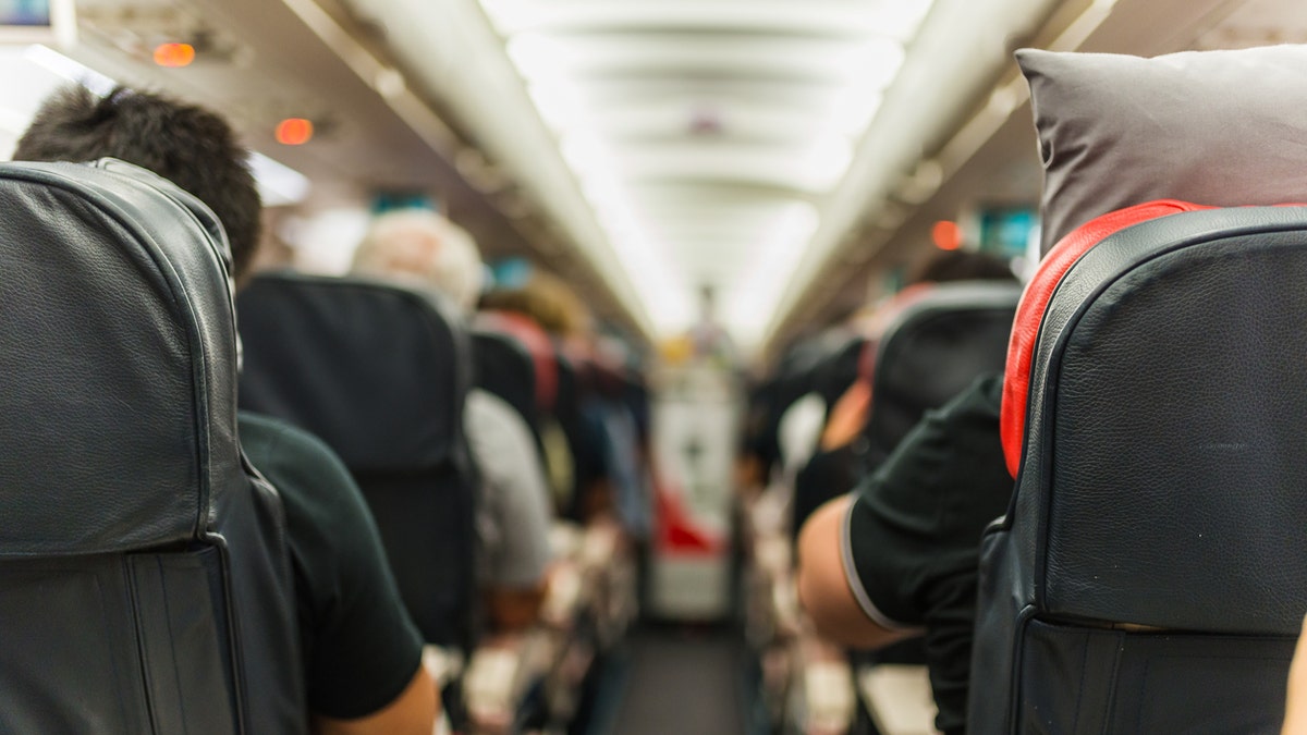 airplane cabin passengers istock medium