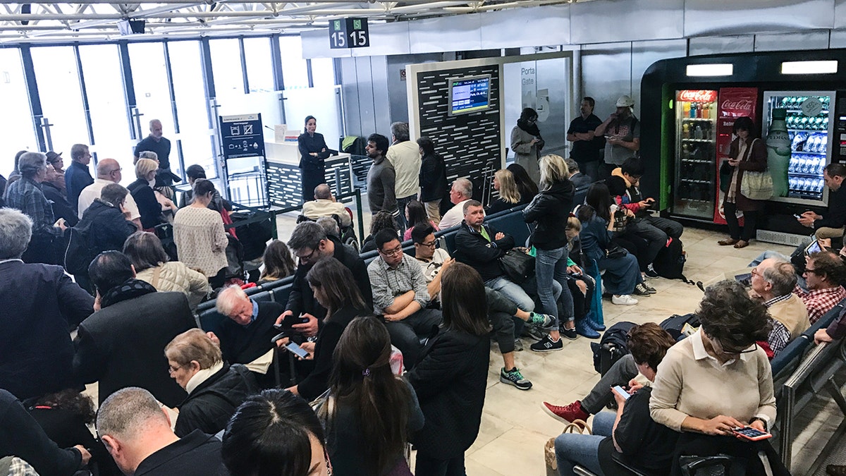 Crowded airport terminal istock
