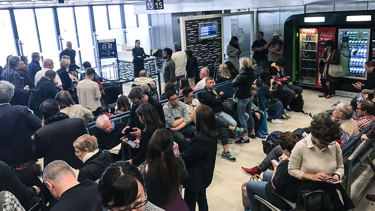 Crowded airport terminal istock