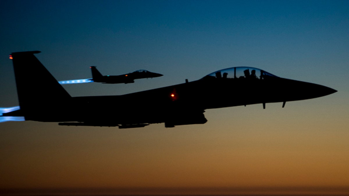 Sept. 23, 2014: In this photo released by the U.S. Air Force, a pair of U.S. F-15E Strike Eagle flies over northern Iraq, after conducting airstrikes in Syria. U.S.-led coalition warplanes bombed oil installations and other facilities in territory controlled by Islamic State militants in eastern Syria. (AP)