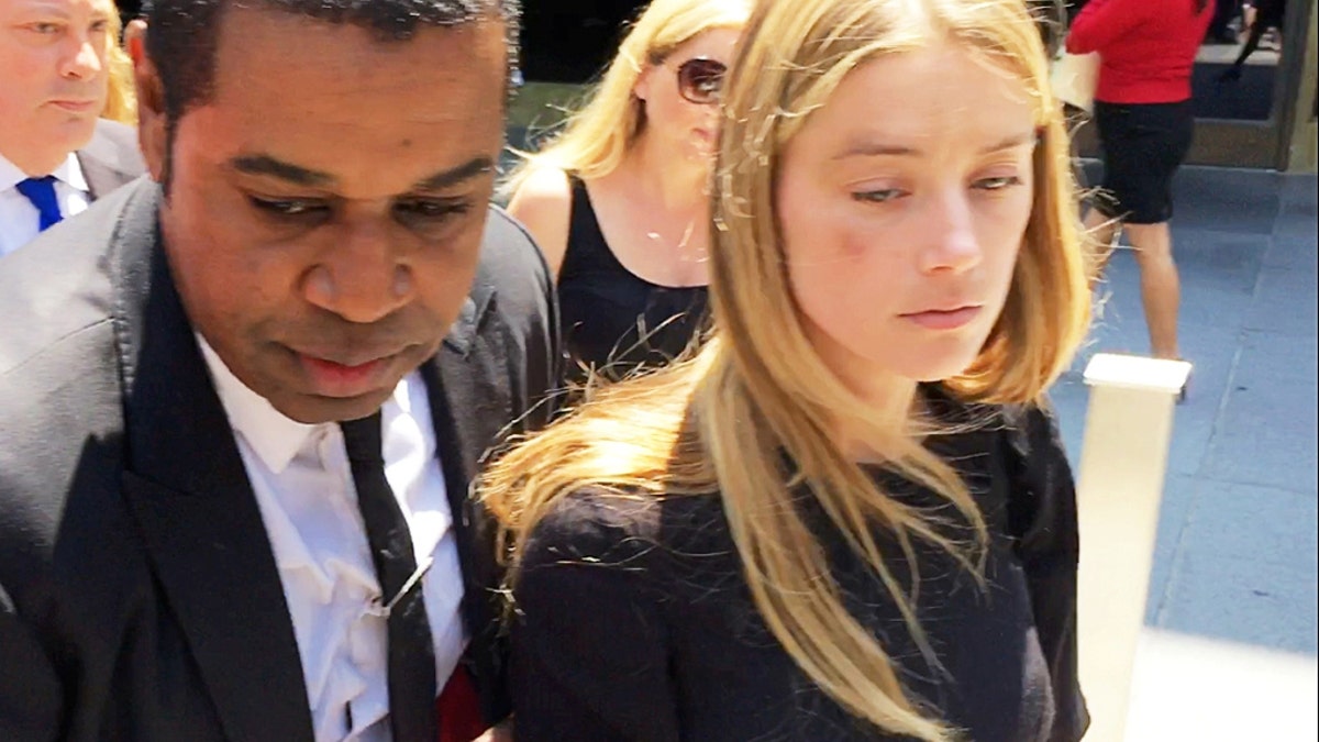 Actress Amber Heard leaves the Superior Court of Los Angeles in Los Angeles, California, U.S. May 27, 2016, with what appears to be a bruise on her right cheek after obtaining a restraining order against husband Johnny Depp in this still image from video. REUTERS/Rollo Ross     TPX IMAGES OF THE DAY      - S1BETGNKADAA