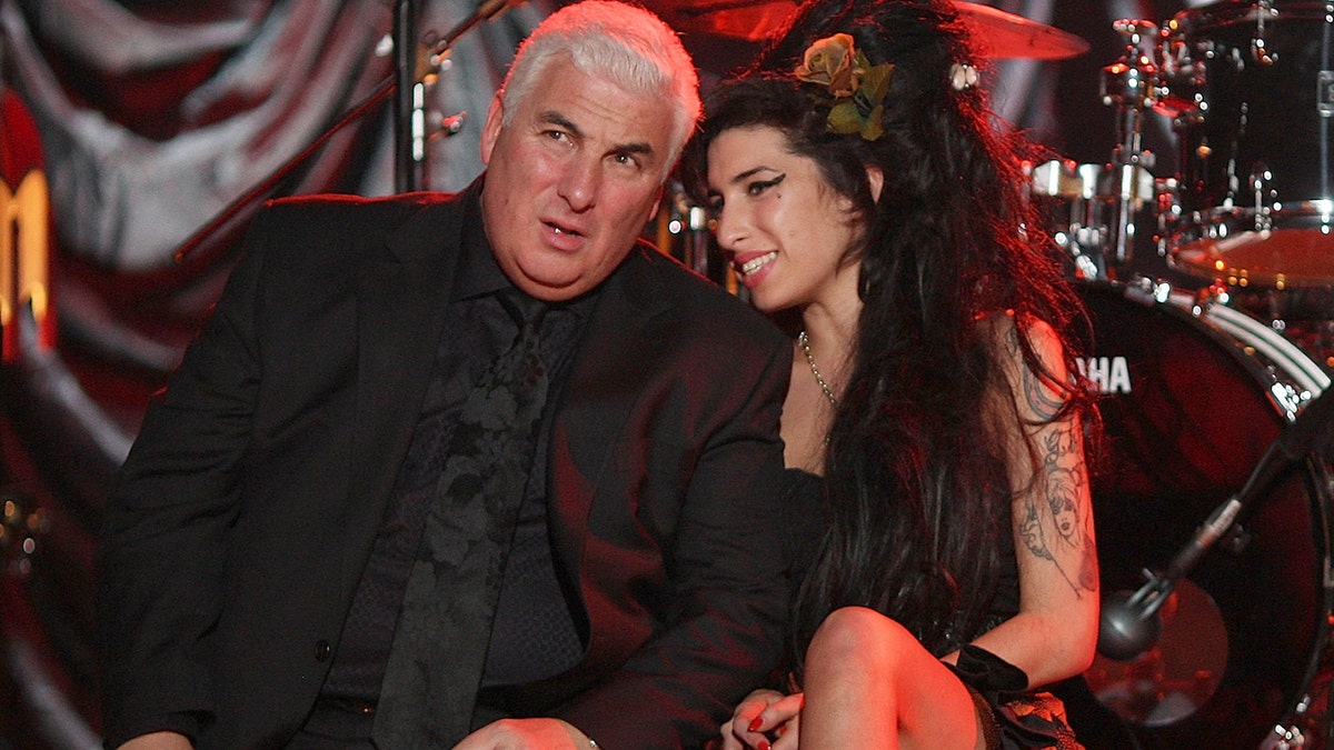 LONDON - FEBRUARY 10: British singer Amy Winehouse sits with her father Mitch as they await news of her Grammy Award at The Riverside Studios for the 50th Grammy Awards ceremony on February 10, 2008 in London, England. Winehouse won 5 out of her 6 nominations including, record of the year, best new artist, song of the year, pop vocal album and female pop vocal performance. (Photo by Peter Macdiarmid/Getty Images for NARAS)