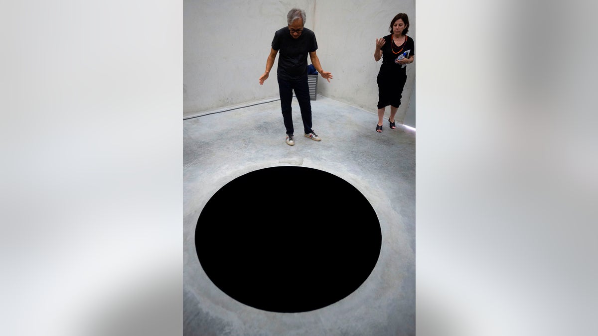 Anish Kooper, 'Descent into Limbo' hole installation, July 2018, Getty Images