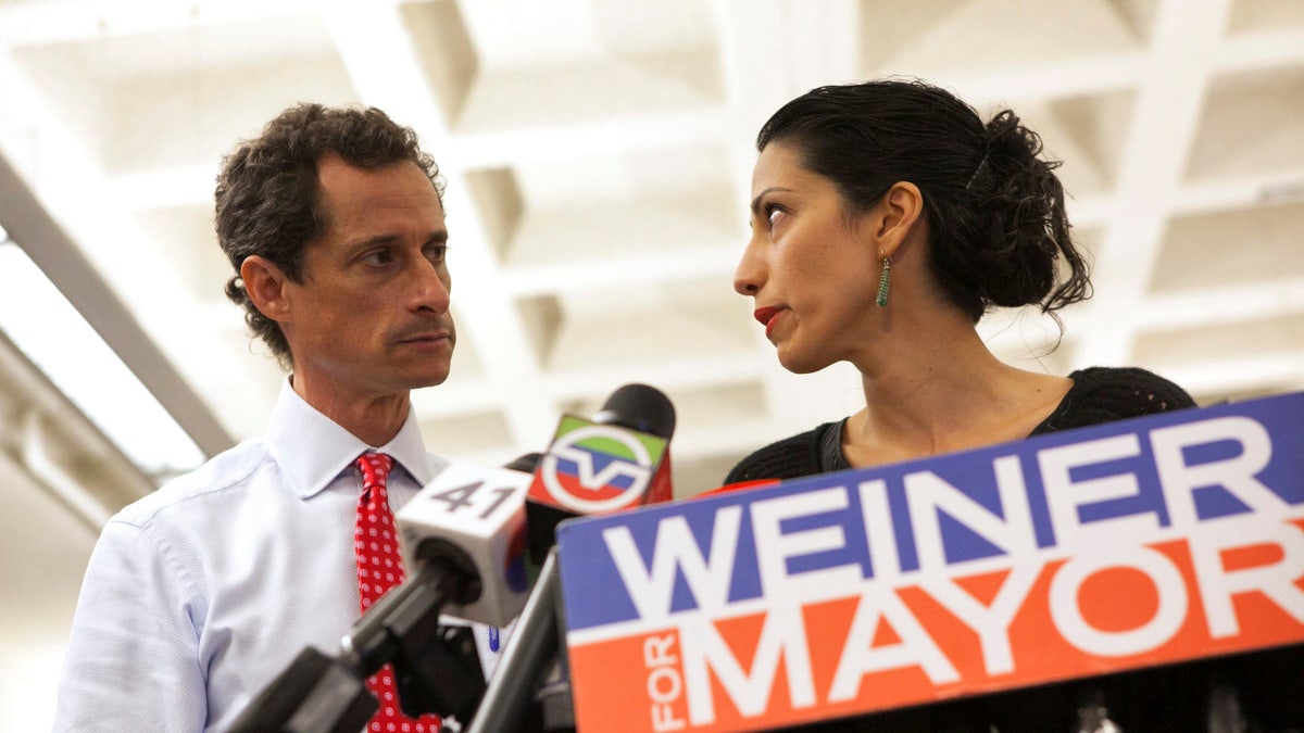 New York mayoral candidate Anthony Weiner and his wife Huma Abedin attend a news conference in New York, July 23, 2013. REUTERS/Eric Thayer/File Photo TPX IMAGES OF THE DAY - RTX2NHP1