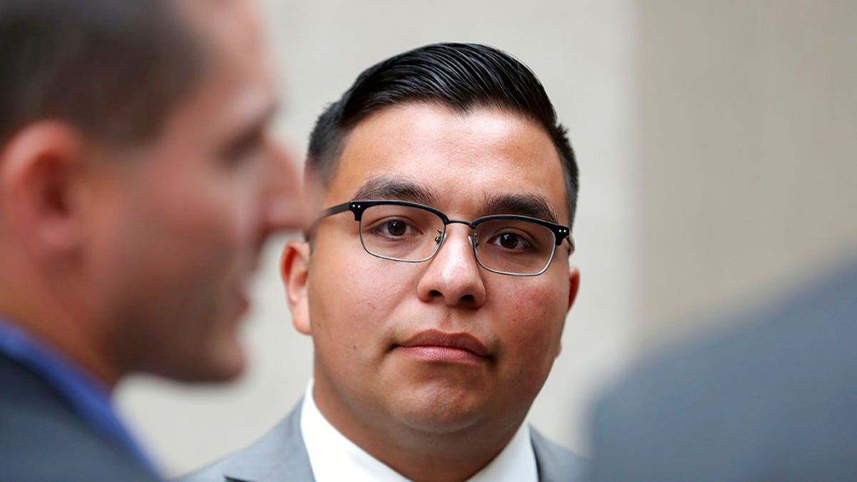FILE - In this May 30, 2017, file photo, St. Anthony police officer Jeronimo Yanez stands outside the Ramsey County Courthouse while waiting for a ride in St. Paul, Minn. Closing arguments are set for Monday, June 12, in a Minnesota police officerâs manslaughter trial in the death of a black motorist. (David Joles/Star Tribune via AP, File)