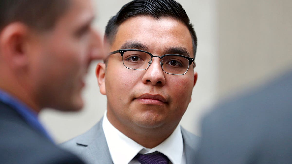 FILE - In this May 30, 2017, file photo, St. Anthony police officer Jeronimo Yanez stands outside the Ramsey County Courthouse while waiting for a ride in St. Paul, Minn. Closing arguments are set for Monday, June 12, in a Minnesota police officerâs manslaughter trial in the death of a black motorist. (David Joles/Star Tribune via AP, File)