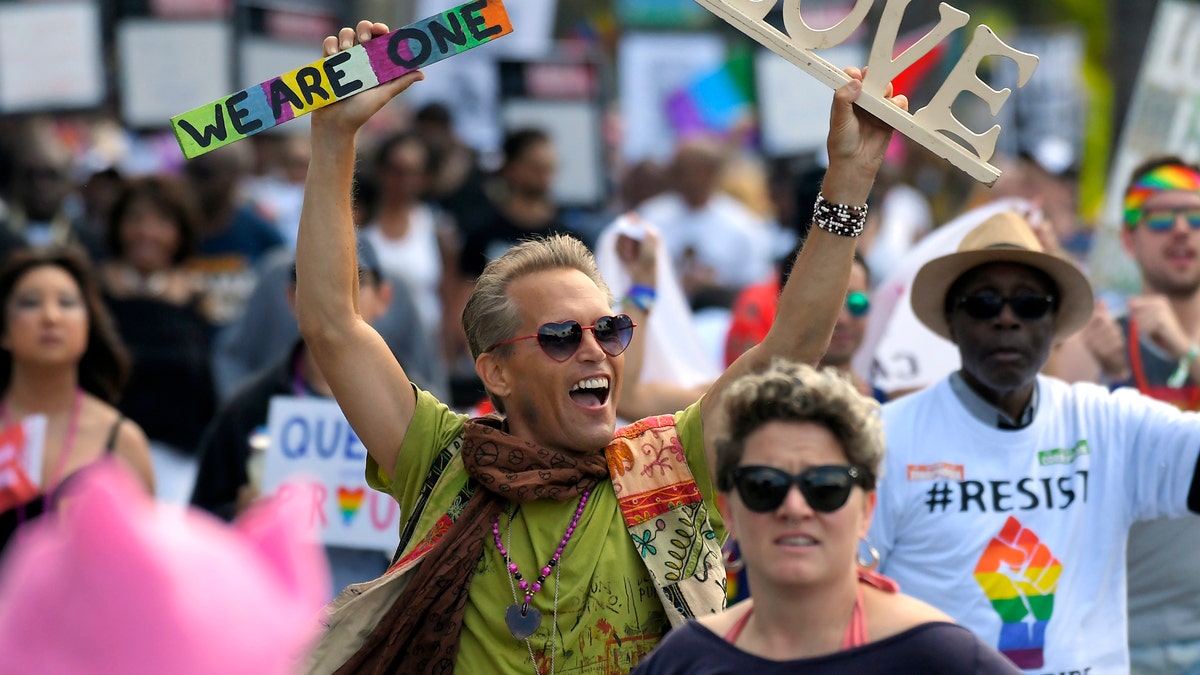Marchers celebrate during the Los Angeles LGBTQ #ResistMarch, Sunday, June 11, 2017, in West Hollywood, Calif. (AP Photo/Mark J. Terrill)